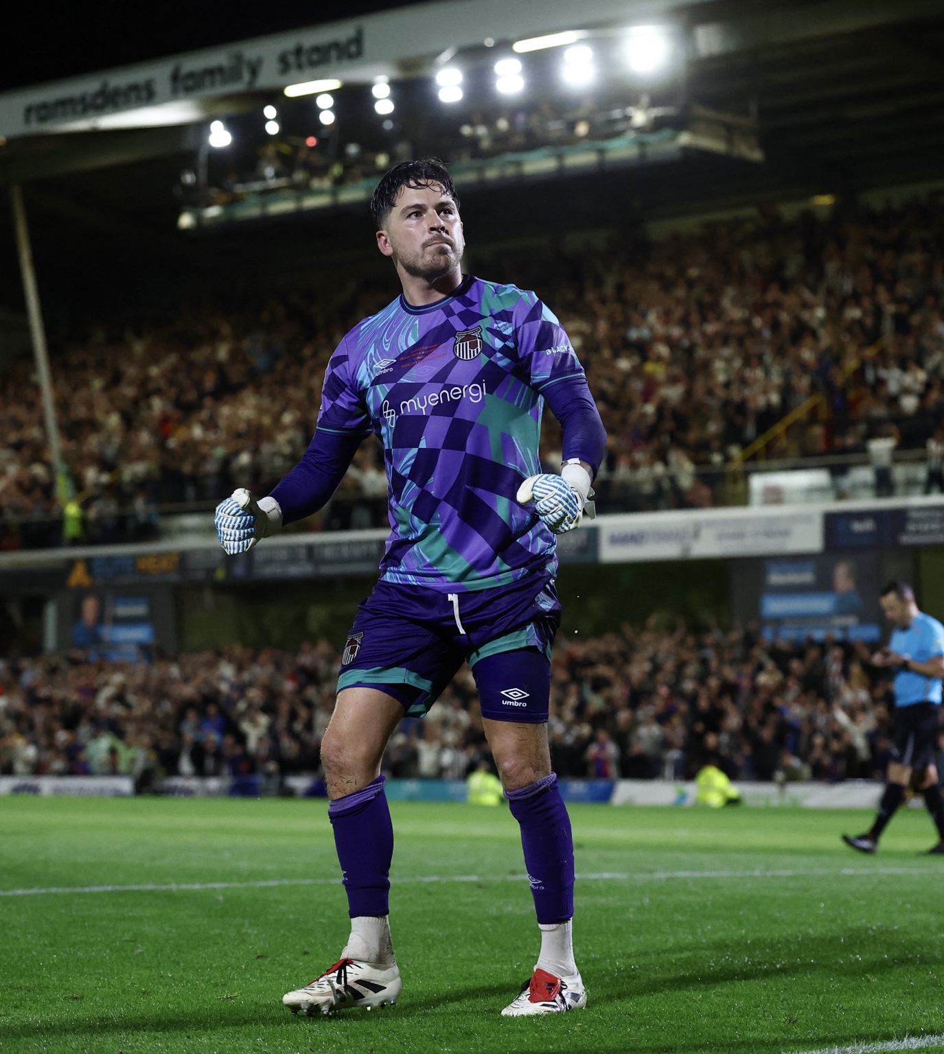 Christy Pym on the pitch in his goalkeeper kit under the floodlights